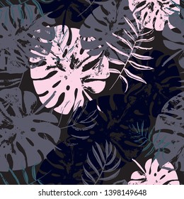Vector beach seamless pattern wallpaper of vintage grunge tropical leaves of palm trees on the black background. Vector seamless pattern. Tropical illustration. Jungle foliage. Cool floral wallpaper