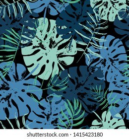 Vector beach seamless pattern wallpaper of green and blue tropical leaves of palm trees on the black background. Vector seamless pattern. Tropical illustration. Jungle foliage. Cool floral wallpaper