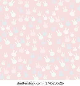Vector beautiful blue bunny and white rabbit silhouette seamless pattern on pink background. Perfect for fabric, textile, nursery decoration, card, scrapbooking. Surface pattern design.
