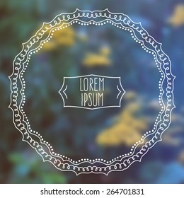 Vector beautiful Indian frame on blurred floral background 