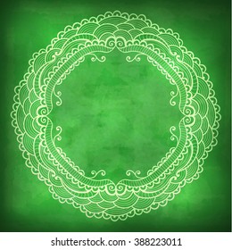 Vector beautiful lace frame on a green background with grunge effects.