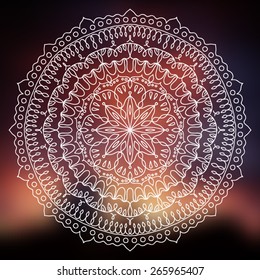 Vector beautiful mandala on dark blurred sunset background