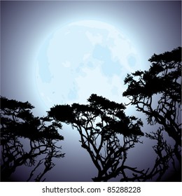 vector big blue moon and silhouettes of tree branches