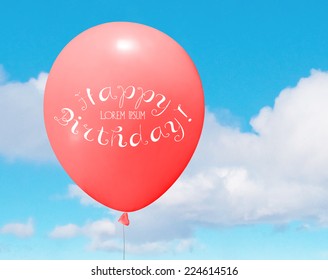 Vector birthday greeting card, red helium balloon over a blue sky with clouds