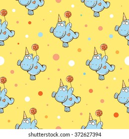 Vector birthday seamless pattern with cartoon funny hippos, candies and confetti on  yellow background.