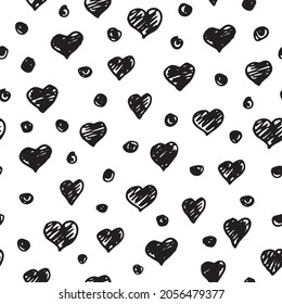 Vector black doodle hearts on a white background seamless pattern. Hand drawn, fun and lighthearted design. Perfect for fabric, wallpaper, scrapbooking and stationery.