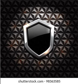 Vector black glossy metal shield on black vintage background