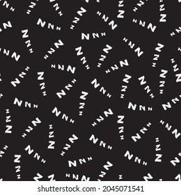 Vector black seamless pattern with scattered cartoon letters z. Suitable for textile, gift wrap and wallpaper.