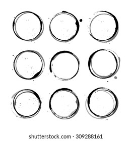 Vector black shapes of Wine circle and Coffee ring stains. Wine glass marks or coffee cup round stains and dirty splashes and spots isolated. Hand drawn tea or ink ring stains on white background.