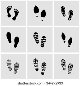 Vector black shoes imprints icon set.