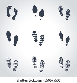 Vector black shoes imprints icon set.