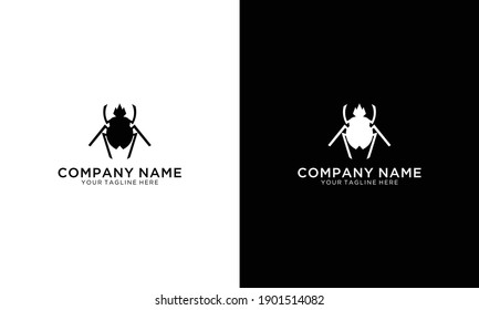 Vector black silhouette of a scarab beetle isolated on a white background.