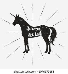 Vector black silhouette of a unicorn on a grey background