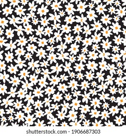 Vector black and white scattered fun daisy flowers repeat pattern with orange center. Suitable for textile, gift wrap and wallpaper.