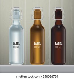 Vector blank glass bottles in three colours on wood background