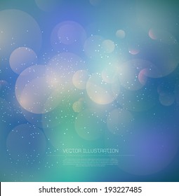 Vector blue blurry glowing bokeh background with glitter.