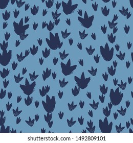 Vector blue dinosaur footprints repeat pattern  Perfect for textile  giftwrap   wallpaper 