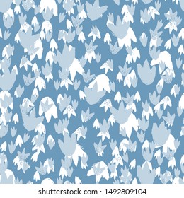 Vector blue dinosaur footprints texture repeat pattern. Perfect for textile, giftwrap and wallpaper.