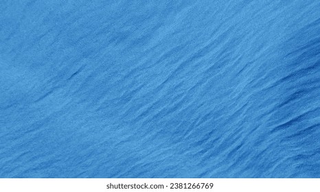 Vector blue fabric texture. Blue fabric with folds. Blue vector background. Marine background. Pastel blue texture.