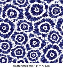 Vector blue indigo shibori circle flowers abstract pattern. Suitable for textile, gift wrap and wallpaper.