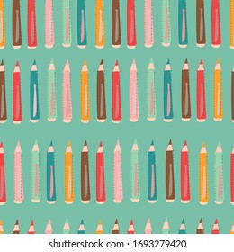 Vector blue seamless pattern with colorful pencils.