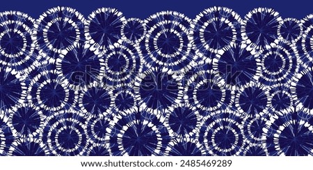 Vector blue shibori circle wheels overlap horizontal border pattern. With spiderweb detail. Suitable for invitation cards and posters.
