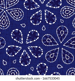 Vector blue shibori floral pattern with canvas background. Suitable for textile, gift wrap and wallpaper.