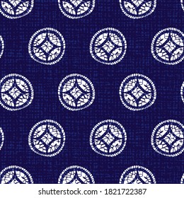 Vector blue shibori quilt large abstract circle seamless pattern with canvas background. Suitable for textile, gift wrap and wallpaper.