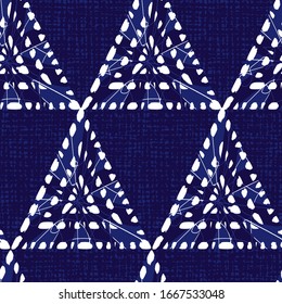 Vector blue shibori triangle abstract seamless pattern. Suitable for textile, gift wrap and wallpaper.