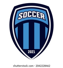 Vector Blue Soccer Team Logo With Shield, Inner Arch And Stripes. Sports Illustration With Soccer Inscription And Year.