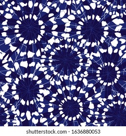 Vector blue and white abstract floral shibori circles overlap patten. Suitable for textile, gift wrap and wallpaper.