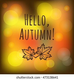 Vector blurred autumn abstract background with bokeh effect, brown leaves and text "Hello, Autumn!" .