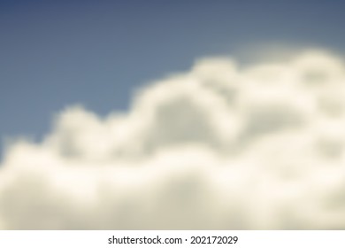 Vector blurred background. Warm color toned clouds on sky
