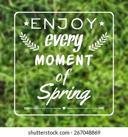 Vector blurred illustration with grass and "Enjoy every moment of Spring" typographical phrase