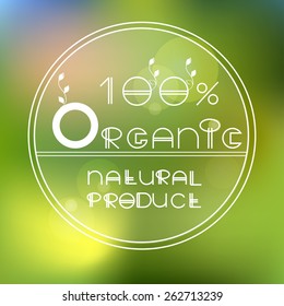 Vector blurred nature background with eco label of   Organic natural product. Eco products, organic standard, or premium quality green product. 