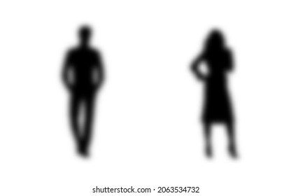 Silhouettes vectorial borroso de un hombre y una mujer, un par de hombres de negocios de pie, color negro aislado en un fondo blanco. Vector.