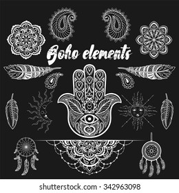 Vector bohemian ornamental elements, ethnic makhenda,  hand drawn boho tattoo design in doodle style. Zentangle patterned illustration isolated on black background. Henna spirituality.