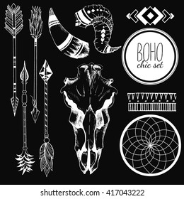 Vector Boho chic set of goat skull, tribal arrows, horn, antler, dreamcatcher and traditional bohemian geometry. Isolated on black background.