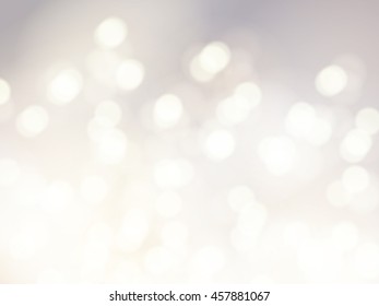 Vector bokeh background. Festive defocused white lights. Abstract blurred illustration.