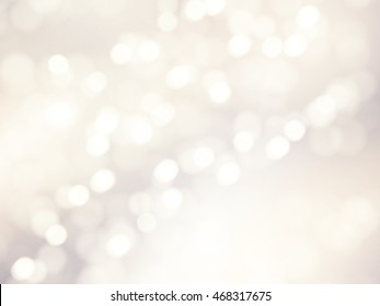 Vector bokeh background. Festive defocused white lights. Abstract blurred illustration.