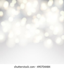 Vector bokeh background. Festive defocused white lights. Abstract blurred illustration.