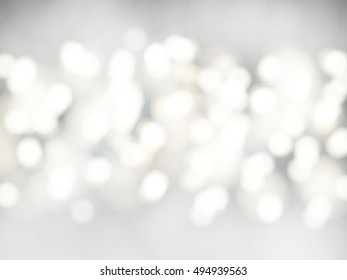 Vector bokeh background. Festive defocused white lights. Abstract blurred illustration.