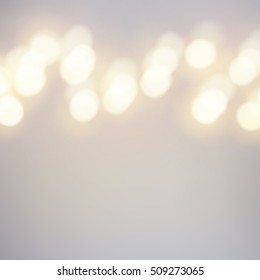 Vector bokeh background. Festive defocused warm yellow lights. Abstract blurred illustration.