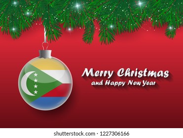 Vector border of Christmas tree branches and ball with Comoros flag. Merry Christmas and happy new year. 