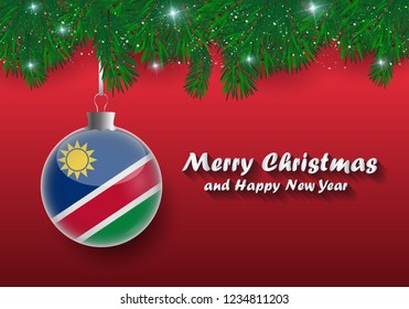 Vector border of Christmas tree branches and ball with namibia flag. Merry christmas and happy new year. 