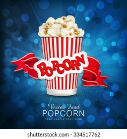 vector box with popcorn on a blue background with a bright red ribbon.