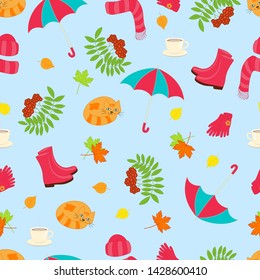 Vector bright beautiful seamless pattern with autumn set on blue background: umbrella, boots, cat, tea, rowan, leaves, hat, scarf