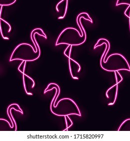 Vector bright neon lamp seamless pattern with pink flamingos. Glowing bird silhouettes on dark purple background 