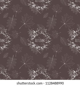 Vector brown seamless pattern with leaves of different trees with word autumn in the blot of paint.