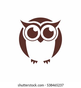 Vector brown silhouette of an owl on a white background.